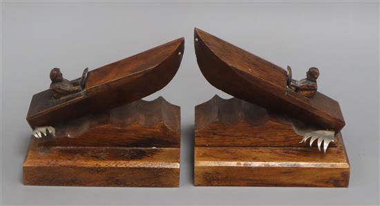 J.Perard A pair of carved oak speedboat bookends